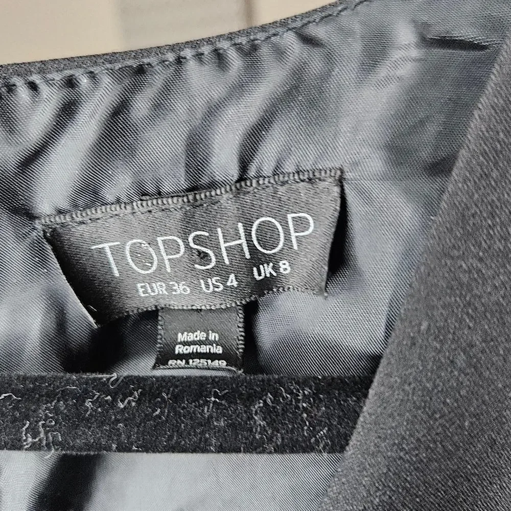 TOPSHOP black low cut romper with a back zipper